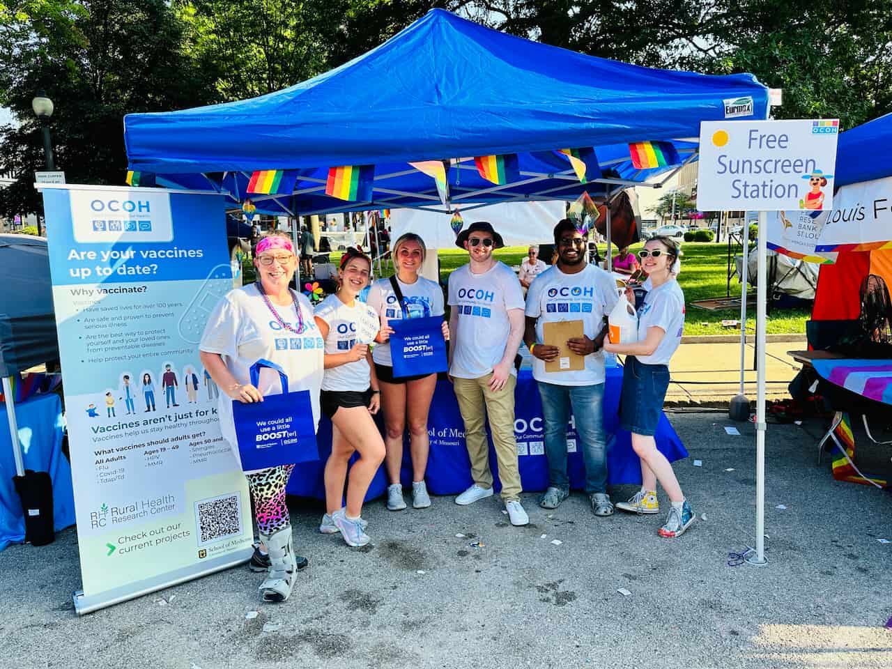 Out, Proud, and Healthy employees pose at St Louis Pride